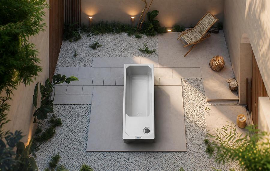 Cold plunge tub installed on a stone patio in a minimalist courtyard setting