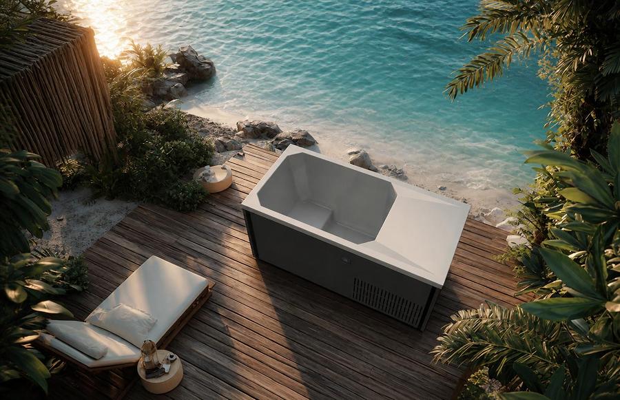 Cold plunge tub on a timber deck overlooking the ocean at sunset